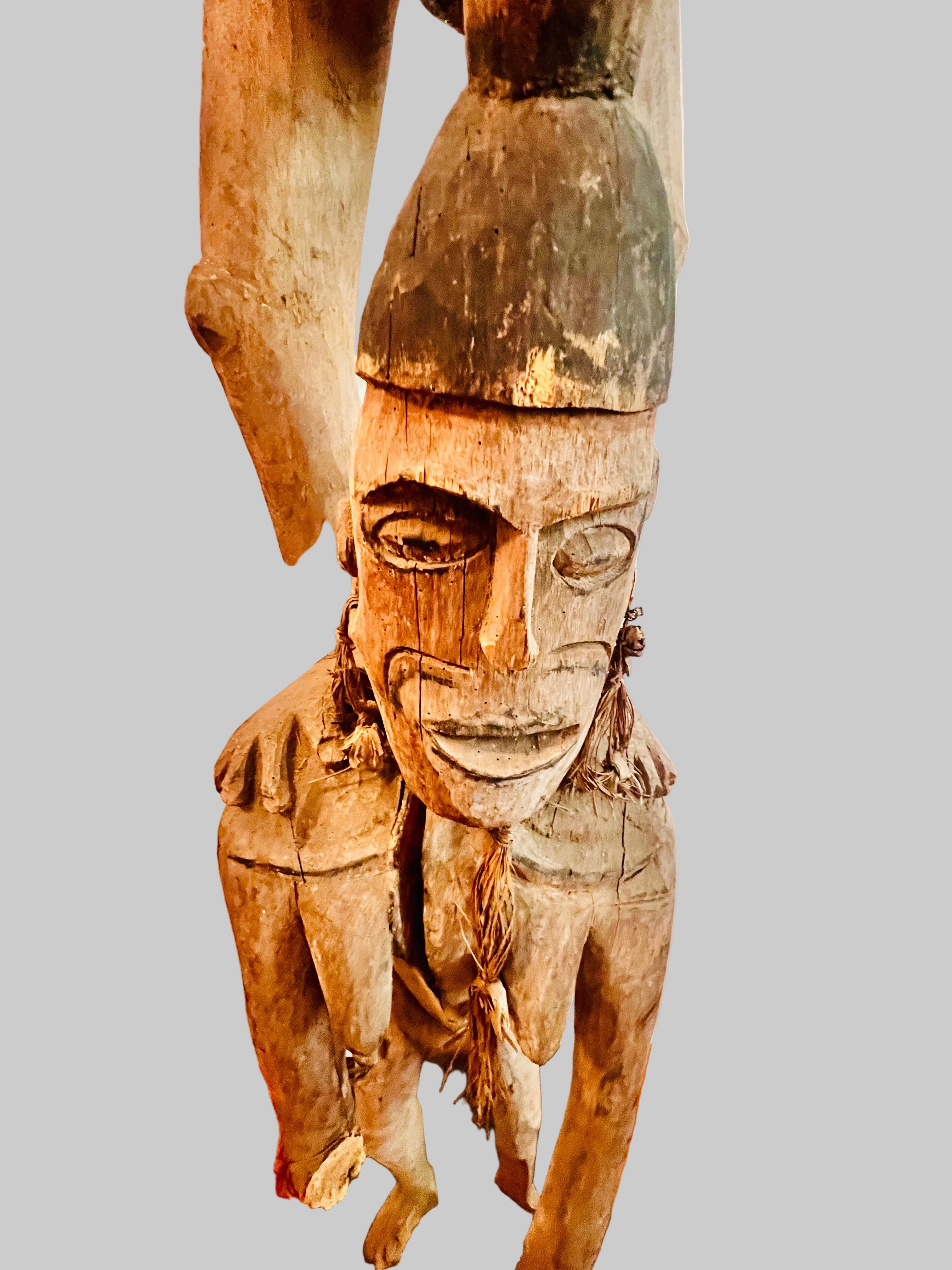 Lower Figure of large Asmat ancestral figure from Papua New Guinea, carved timber, mid-20th century, displayed on custom metal stand